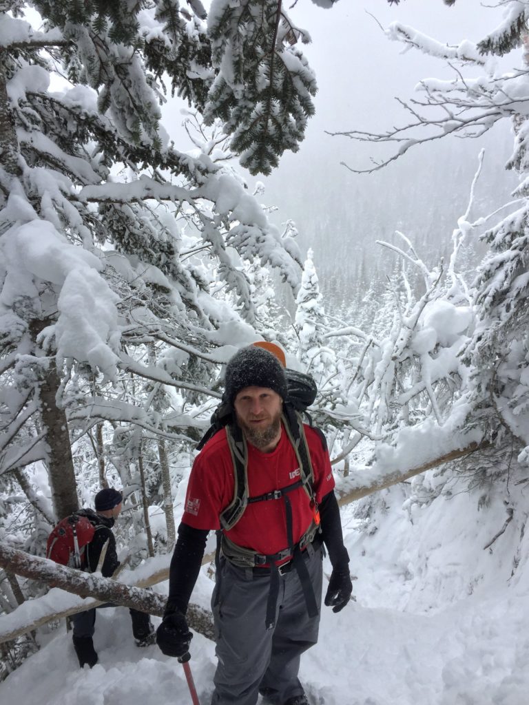 A brief rest after a steep climb in deep snow